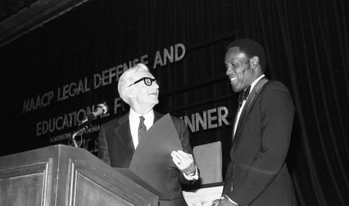 Rafer Johnson receiving an award from Paul Ziffren, Los Angeles, 1984