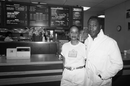 Chicken Charlie's owners Mr. and Mrs. Griffis posing together, Los Angeles, 1987