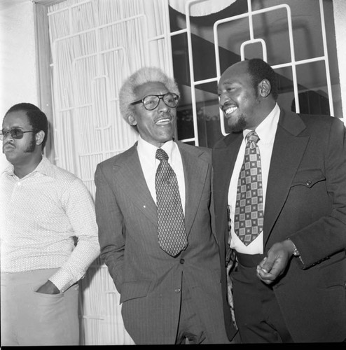 Bayard Rustin talking with Samuel McNeal, Jr., Los Angeles, 1973