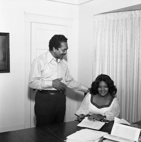 Mervyn Dymally talking with his daughter Lynn Dymally, Los Angeles, 1973