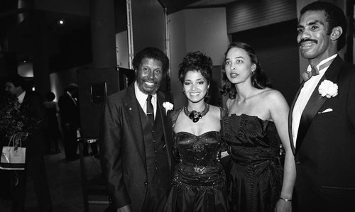 Guests posing together at the California African American Museum exhibit "The Black Olympians," Los Angeles, 1985