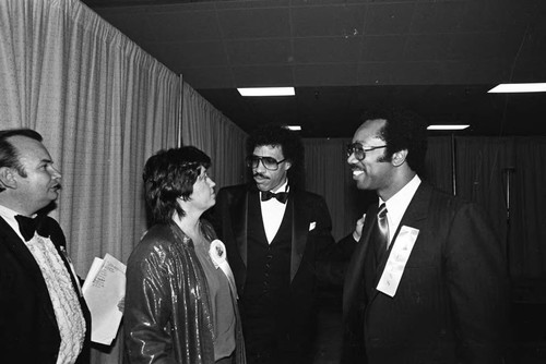 Lionel Richie talking with Ruth Adkins Robinson and Cornelius Grant, Los Angeles, 1983