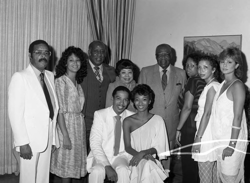 Mr. and Mrs. Steven Criss and others pose for a group portrait, Los Angeles, 1983