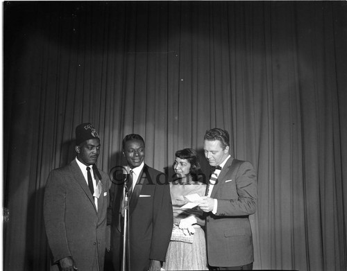 Nat King Cole at microphone, Los Angeles, 1957