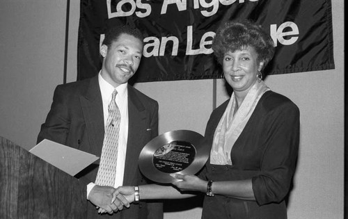 David Cunningham, III presenting an Urban League award to a One Voice representative, Los Angeles, 1992