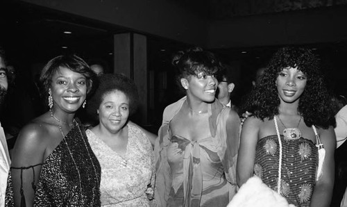 Thelma Houston and Donna Summer posing with others during the NAACP Image Awards, Los Angeles, 1978