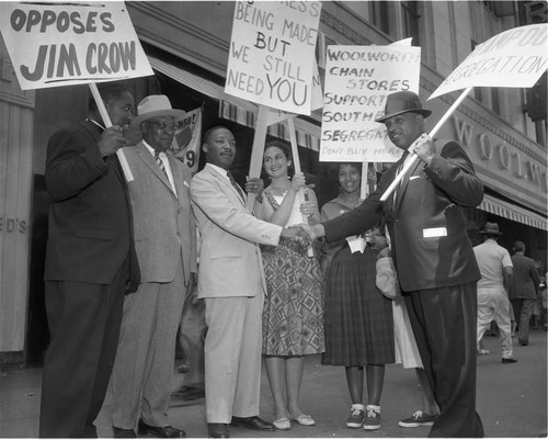 Dr. Martin Luther King Jr. standing with picketers at a Woolworth store, Los Angeles, 1960