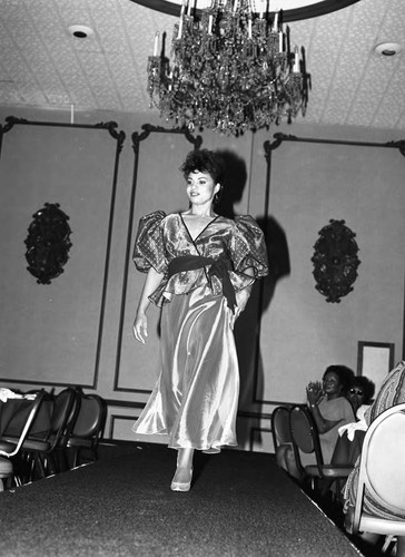 Lula Fields modeling student walking the runway during graduation, Los Angeles, 1985