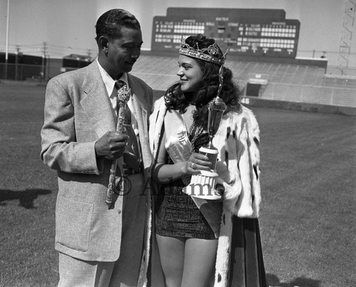 Leon Hefflin, Sr. presenting a trophy to Tina Thomas, Queen of the 8th annual Cavalcade of Jazz, Los Angeles, 1952