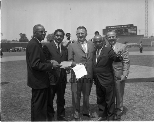 Conference of the Unemployed officials standing together at Wrigley Field, Los Angeles, 1964