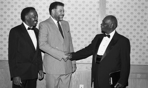 Arkansas Alumni dinner attendees greeting each other, Los Angeles, 1987