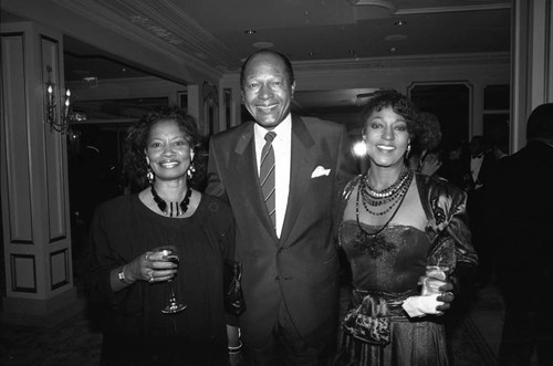 Tom Bradley posing with Paula Kelly at the Black Emmy nominees dinner, Los Angeles, 1989