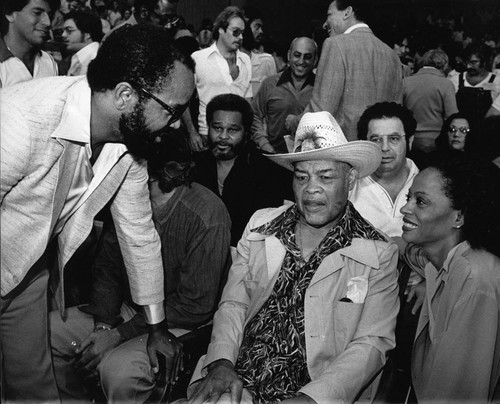 Berry Gordy, Joe Louis, and Diana Ross among a crowd, Las Vegas, 1979