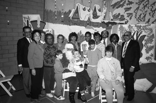 Theta Mu Omega and Mesa Kiwanis members posing with children at the Foundation for the Junior Blind, Los Angeles, 1989