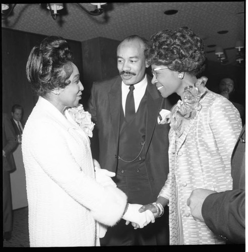 Shirley Chisholm greeting an unidentified woman, Los Angeles, 1970