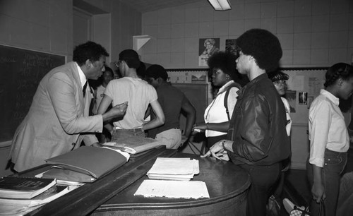 Man talking with students during Career Day at Dorsey High School, Los Angeles, 1982