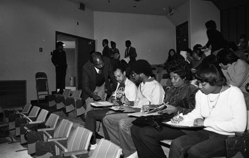 Advisors coaching students during a financial aid workshop, Los Angeles, 1983