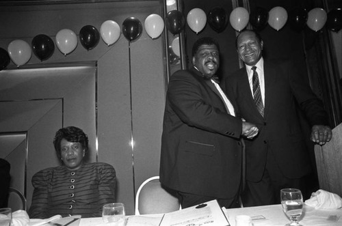 Tom Bradley posing with Dr. T. Larry Kirkland, Los Angeles, 1989