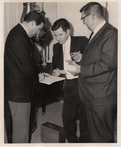 Mexican American Political Association (MAPA) officer installation, Joe de Anda, Rudy Acuña, and Fred Ball (left to right)