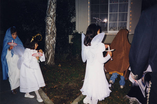 Children re-enacting the Christmas story of Mary and Joseph looking for an inn