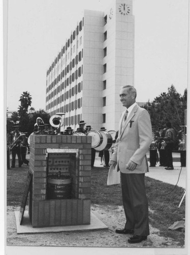 Dr. James Cleary with time capsule, 1983