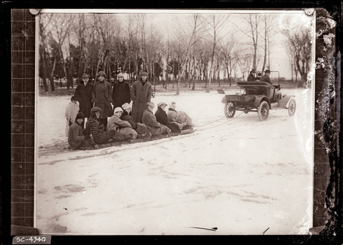 Car pulling snow sled