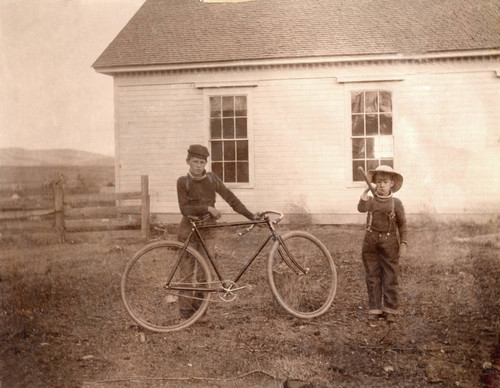 Boys with bicycle