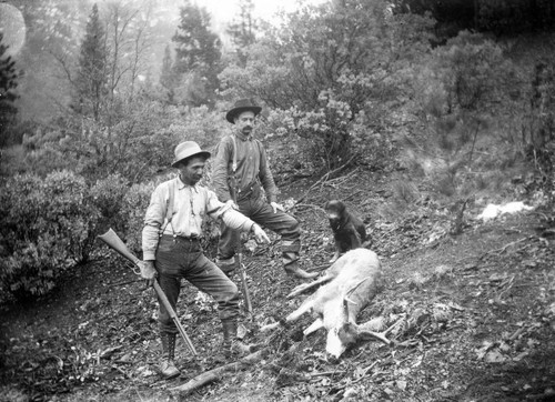 Men Hunting with dead deer