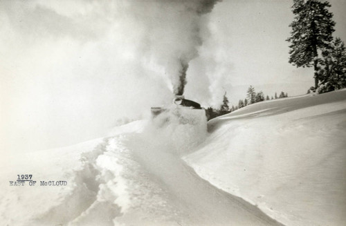 Locamotive Plowing Through Snow