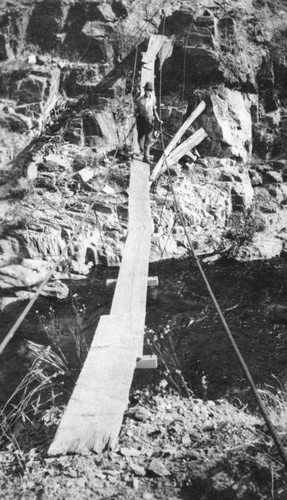 Unidentified man on temporary bridge