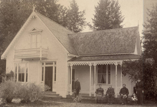 Family in Front of Home