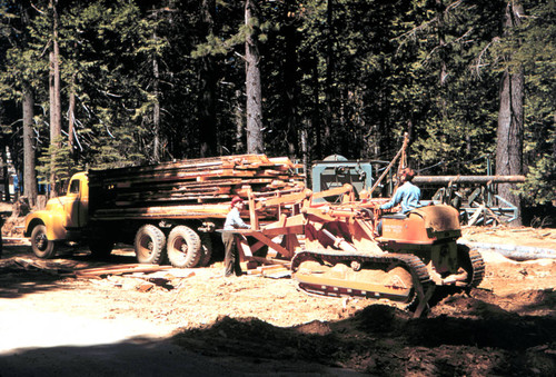 Loading lumber from portable sawmill--Soper-Wheeler Company