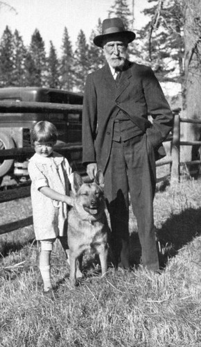 Little girl, man, and dog