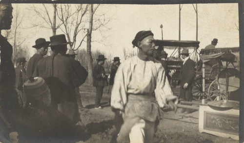 Unknown Chinese men after a funeral procession in Chico