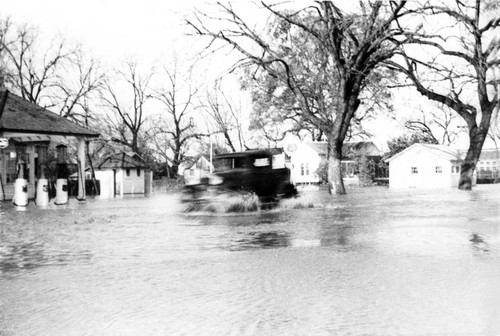 Truck driving through flood waters