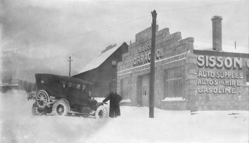 Car in front of Sisson Garage Co