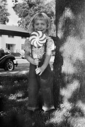 Girl with lollipop at Chico State Vet's Village