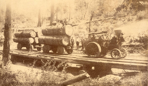 Steam traction engine with two loads of logs