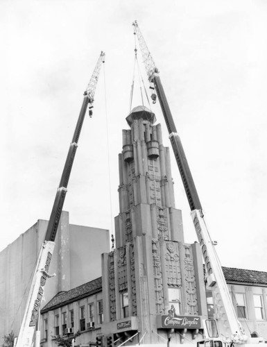 Cranes dismantling tower on Senator Theater building, March, 1999