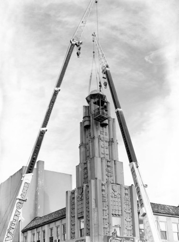 Cranes dismantling tower on Senator Theater building, March, 1999