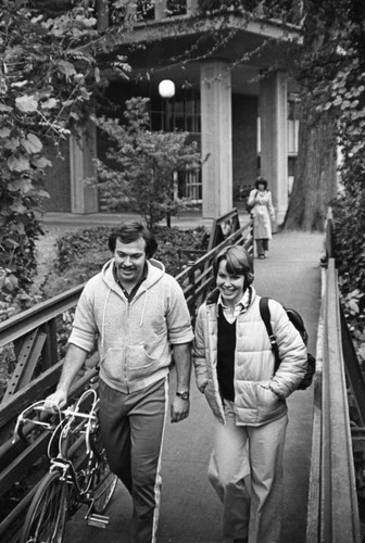 Students Walking Across Bridge on Campus