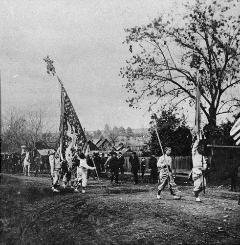 Marching Chinese flag during parade