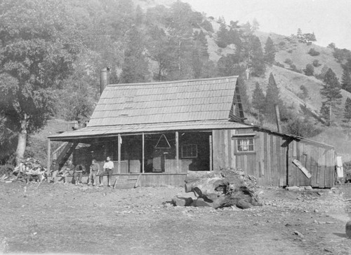 Railroad construction workers seated on porch