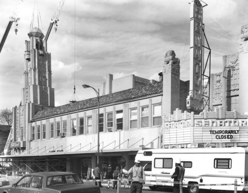 Senator Theater building with crane beginning to dismantle tower, March, 1999