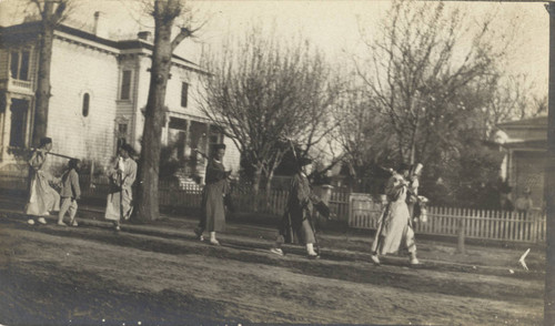 Chinese funeral procession heading west on Fifth Street, Chico, passing the Stansbury residence