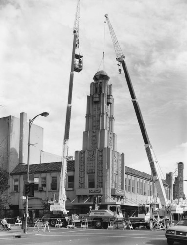 Cranes dismantling tower on Senator Theater building, March, 1999