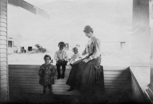 Woman and children on porch