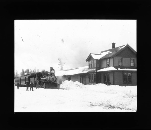 Train in snow at Stirling City railroad station, hand colored lantern slide