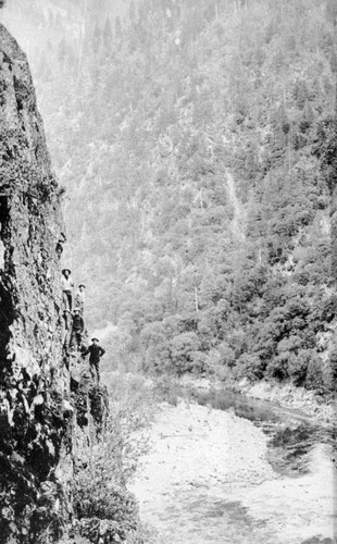 Five men on a steep bank