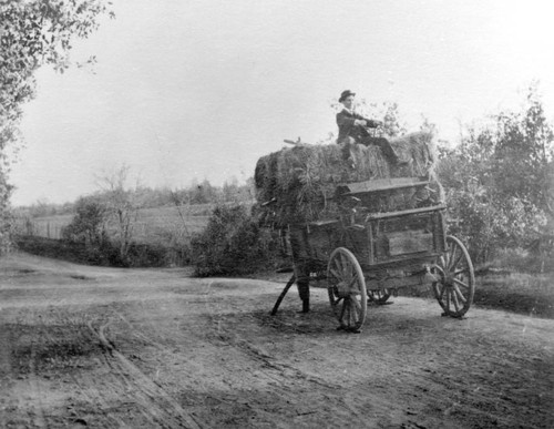 Hay wagon missing a wheel